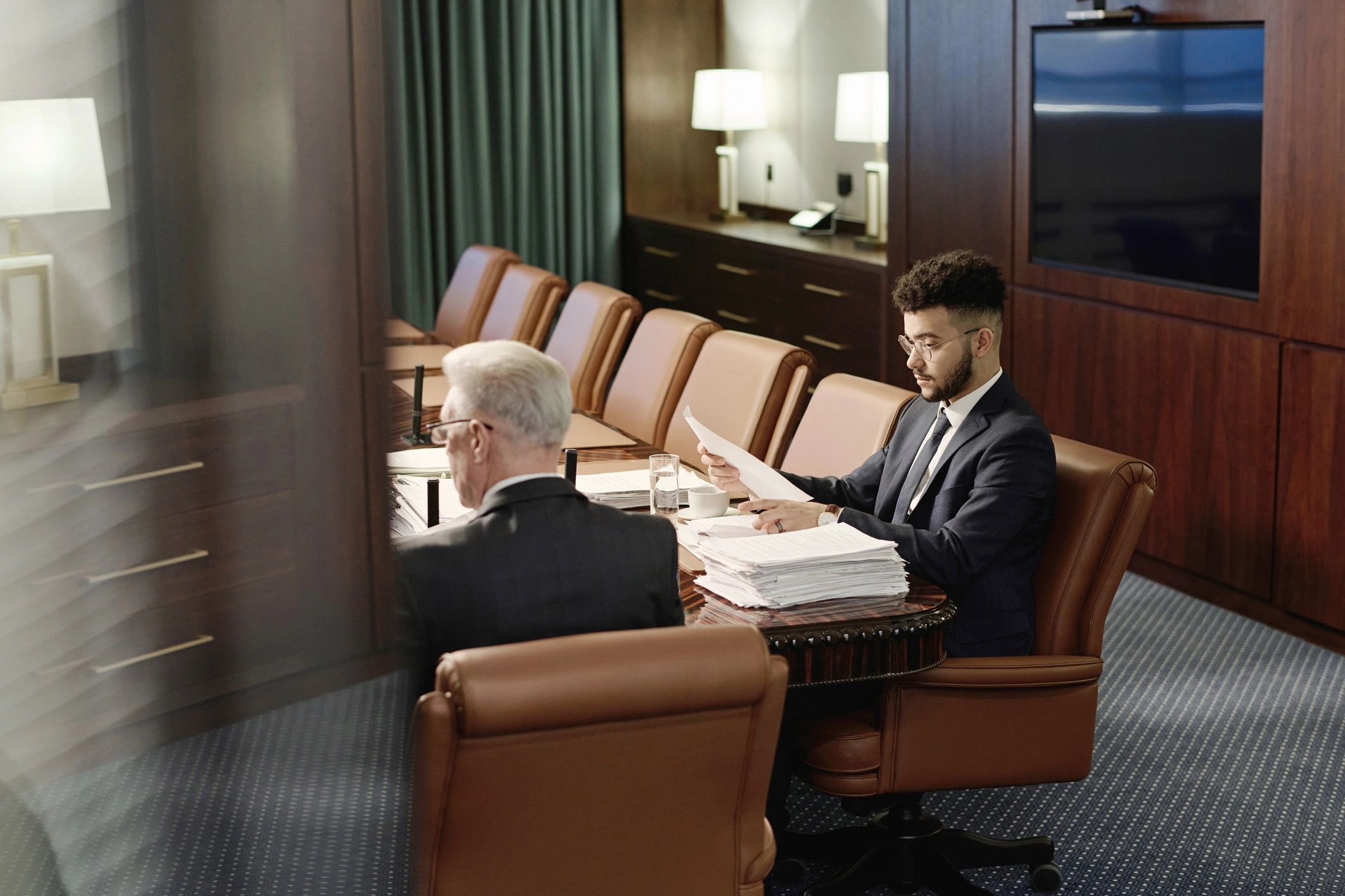 Attorneys reviewing documents together in an office
